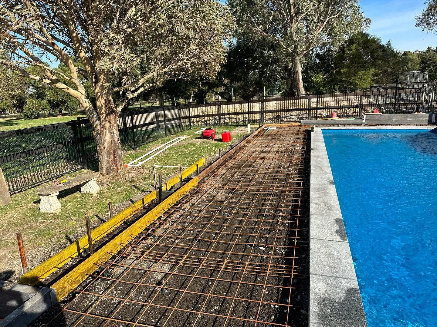 Mesh formwork around the installed pool in the rural backyard