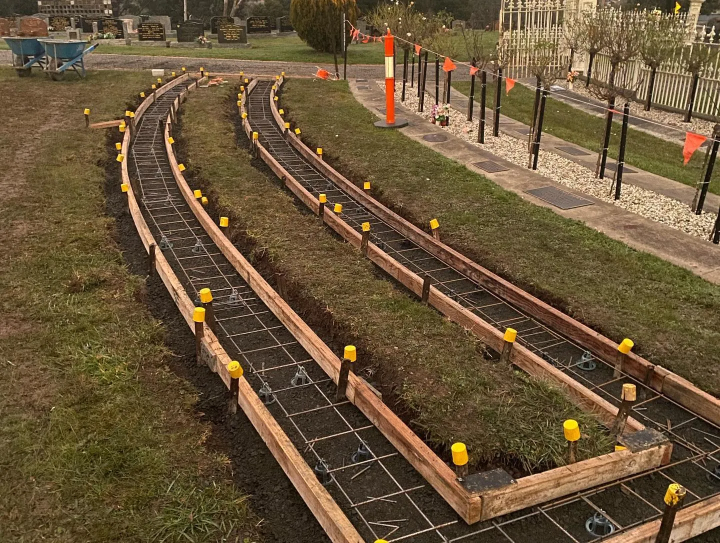Curved timber forms and mesh in place for the same memorial garden kerb pour