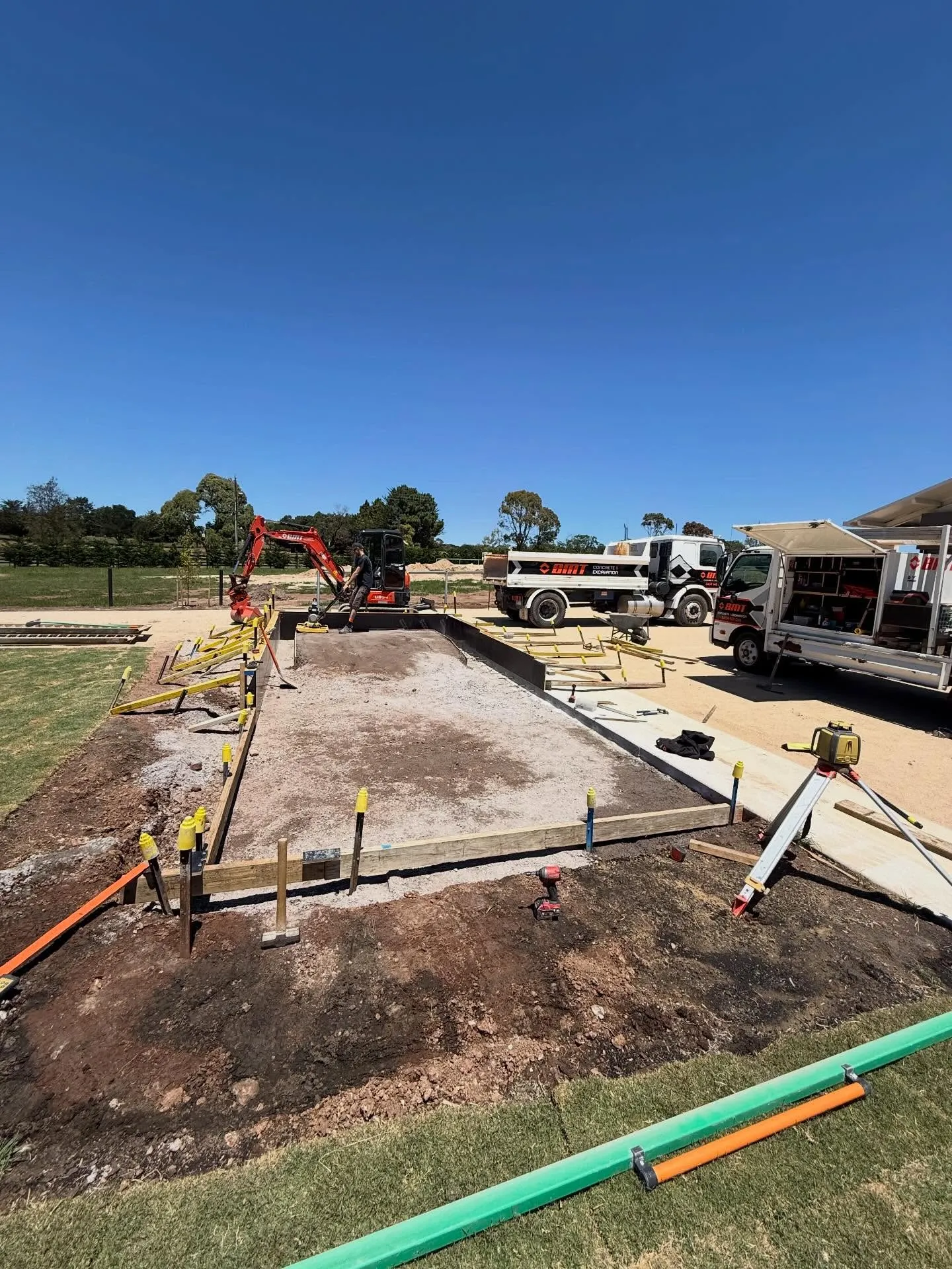 Equestrian tank-stand slab being formed up with a mini-excavator and the BMT truck on site